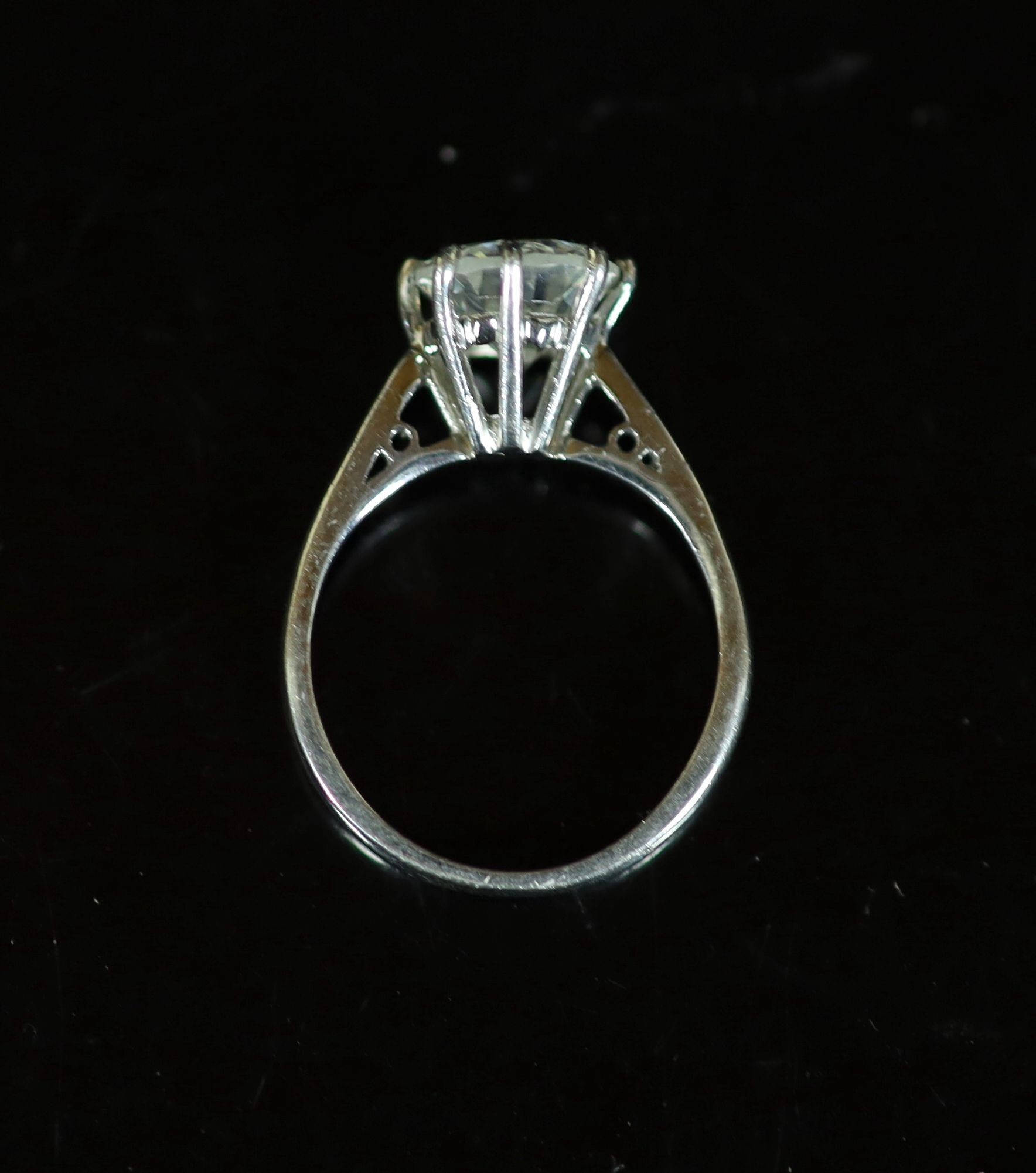 A modern platinum and solitaire diamond ring